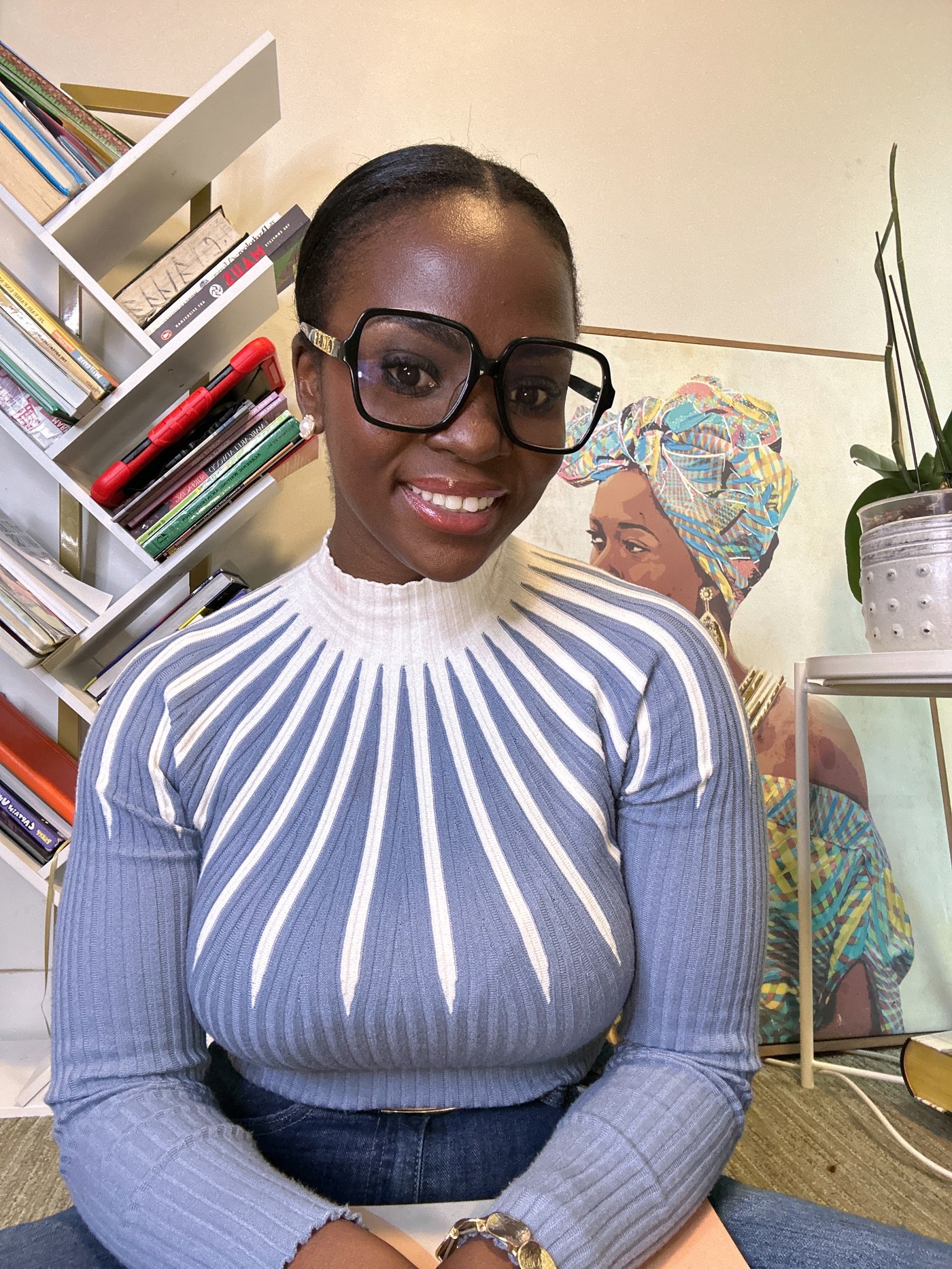 Neola Oleta Husbands in her studio, surrounded by books.